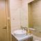 Spacious and Homey 2BR at Tree Park City Cikokol Apartment By Travelio - 当格浪