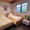 Fiordland Eco-Retreat -- Panoramic Views -- Hot Tub