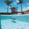 TAF Villas Beach Resort with Tesla