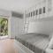 Newly Renovated Beachfront Condo with Inviting Minimalist Design, Pool & Balcony with Ocean Views