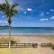 Newly Renovated Beachfront Condo with Inviting Minimalist Design, Pool & Balcony with Ocean Views