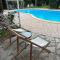 Mediterranean poolside garden cottage