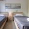 Large Veranda 2BR Walk to Beach