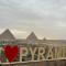 Separate hotel rooms with a view of the pyramids