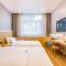 Dequan Luxury Hotel Communication University of China Branch Coffee, fruits, snacks, a gym and a laundry room are provided for free in the lobby - Pékin
