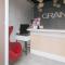 RedDoorz Premium at THE GRAND PENINSULA SUITES