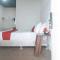 RedDoorz Premium at THE GRAND PENINSULA SUITES