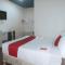 RedDoorz Premium at THE GRAND PENINSULA SUITES