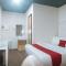 RedDoorz Premium at THE GRAND PENINSULA SUITES