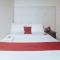 RedDoorz Premium at THE GRAND PENINSULA SUITES