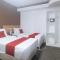 RedDoorz Premium at THE GRAND PENINSULA SUITES