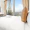 SML Vacation Homes - Sky High Apartments with Burj Khalifa and Dubai Fountain Views at Grande Signature, Downtown Dubai