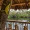 Riverside Breeze Tropical Retreat w Tiki Hut&BBQ