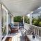 3rd-row beach cottage with ocean views, beach access, deck, & grill