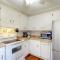 3rd-row beach cottage with ocean views, beach access, deck, & grill