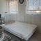 One bedroom with modern kitchen, balcony with water view