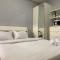 Tranquil Living Studio at Belmont Residence Puri Apartment By Travelio
