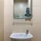 Tranquil Living Studio at Belmont Residence Puri Apartment By Travelio
