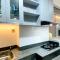 Modern Look Studio at Transpark Cibubur Apartment By Travelio
