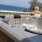 Luxury Beachfront Villa with a Pool