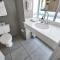 Bright 2BR Escape w Sea View, Pool & Beach Access