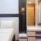 Simply 1BR at 31st Floor Vida View Makassar Apartment By Travelio - Pampang