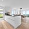 Ferienwohnung Nordglanz – Modernes Beachhouse-Flair im Herzen des OstseeResort Olpenitz