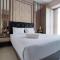 Comfortable and Modern 1BR without Living Room at Amartha View Apartment By Travelio - Семаранг