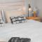 Ultima Escapes - Glenelg Beachfront Bliss - Direct Beach Access, Pool, Gym, Free Parking, Wi-Fi