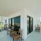 Oceanfront corner views with wrap around balcony and complex pool - New Smyrna Beach