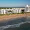 Take in the oceanfront corner views located on the no-drive beach! - New Smyrna Beach