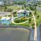 Coastal 2-Bedroom Retreat with Pool & Tennis Court