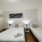 city staycation studio with 2 beds