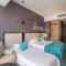 WISDOM Boutique Hotel Near the National Birds Nest National ConventionCentre and Olympic Forest Park Just a 5-minute walk from Line 15s Anli Lu Subway Easy access tothe airport