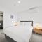 Sleek 2-Bed Apartment with Rooftop Garden Access