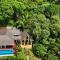 Relax At This Hillside Retreat That Overlooks The Lush Forest And The Caribbean,