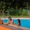 Nivaant Farms by StayVista - Green Retreat with Pool, Orchard, Jacuzzi & Gazebo