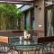 Nivaant Farms & Cottages - Nestled in lush greenery, offering a Swimming pool, Orchard, Jacuzzi & A spacious lawn with gazebo