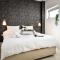 Modern Gem with Stunning Balcony by Sea N Rent