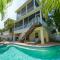 Mango Bay - Gorgeously Renovated Spacious Home wPool Spa Game Room Bikes Walk to Beach