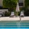 Mediterranean Escape - Steps from the Beach Apartment with Pool