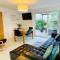 Above the Bay - Enclosed garden apartment with parking