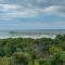3rd-row beach cottage with ocean views, beach access, deck, & grill