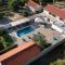 Villa Pietra- Modern rustic poolside oasis