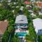 Decked Out - Stunning Home Huge Sunny Resort Style Heated Pool Walk to Pine Ave Beach