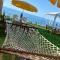 Seafront Apartment by the sea and with a beach and with big garden