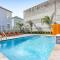 Hosteeva Stunning 4 BR Condo w Pool Steps to St Charles Ave