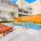 Hosteeva Stunning 4 BR Condo w Pool Steps to St Charles Ave