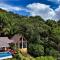 Relax At This Hillside Retreat That Overlooks The Lush Forest And The Caribbean,