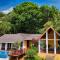 Relax At This Hillside Retreat That Overlooks The Lush Forest And The Caribbean,